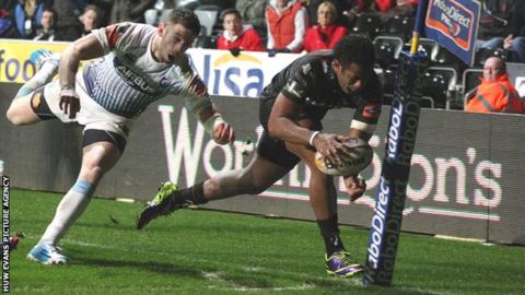 Aisea Natoga crosses for his third try against Cardiff Blues with Alex Cuthbert trailing in his wake