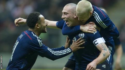 Scotland captain Scott Brown celebrates his winner against Poland