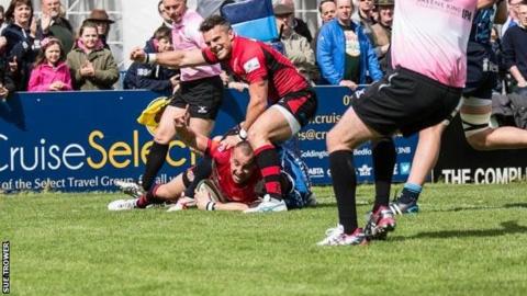 Mark Foster celebrates as Nicky Griffiths goes over for Jersey