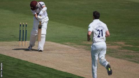 James Middlebrook of Northants looks on, after being bowled by Toby Roland-Jones of Middlesex during their County Championship match