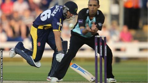 Glamorgan's Stewart Walters survives a run out attempt from Surrey's Robin Peterson