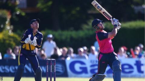 Glamorgan keeper Mark Wallace looks on Middlesex batsman Danny Christian hoists a high one against Glamorgan at Richmond