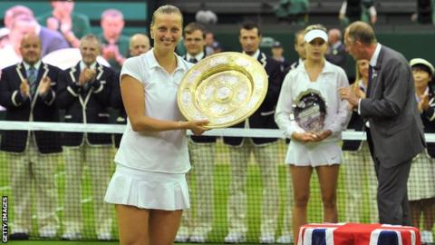 Petra Kvitova poses with the winner's Venus Rosewater Dish