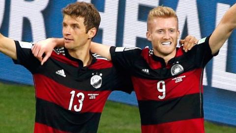 Germany's Thomas Muller and Andre Schurrle celebrate against Brazil