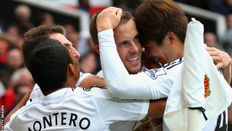 Swansea City players celebrate