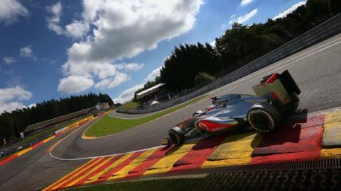 McLaren's Jenson Button drives through Eau Rouge