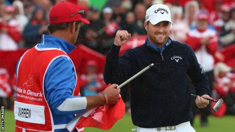 Marc Warren celebrates with his caddie in Denmark
