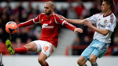 Henri Lansbury is challenged by West Ham's Reece Burke during an FA Cup tie last season
