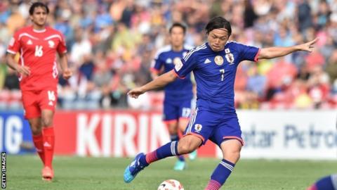 Yasuhito Endo scores a goal for Japan against Palestine