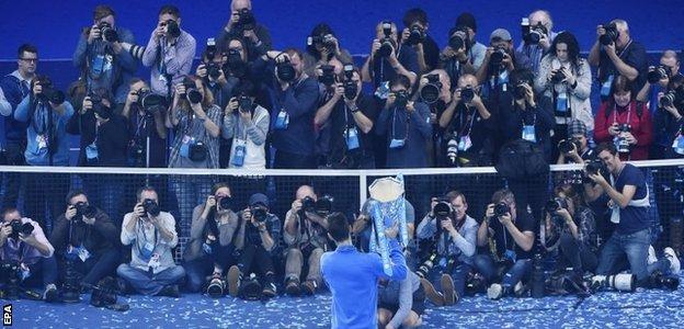 Novak Djokovic shows off the trophy