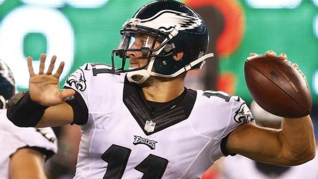 Former NFL quarterback Tim Tebow signs for the New York Mets