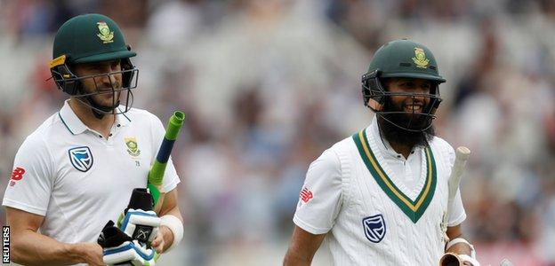 Hashim Amla smiles after another half-century