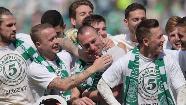 Celtic captain Scott Brown joins the post-match celebrations