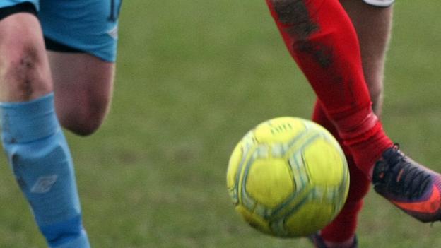 Five footballers banned over match fixing