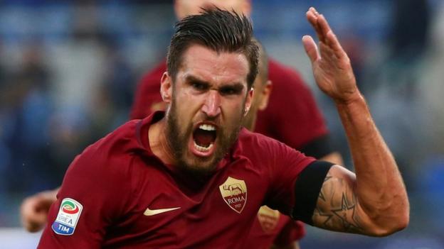 Roma close on leaders Juve after feisty derby win