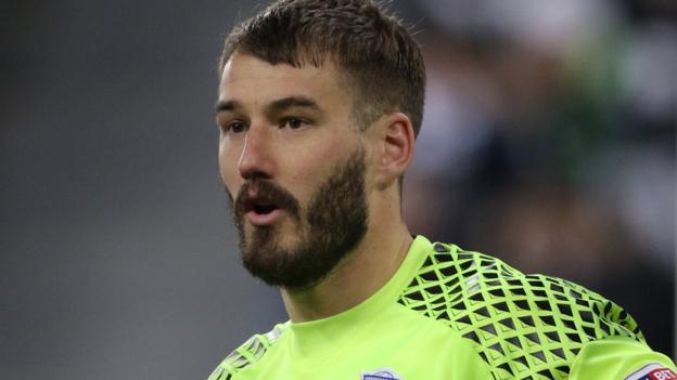 Adam Legzdins: Birmingham City take up one-year extension on keeper's contract