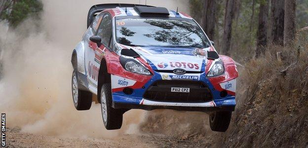 Robert Kubica jumps his Ford Fiesta RS over a brow during the fifth special stage of the World Rally Championship in 2014
