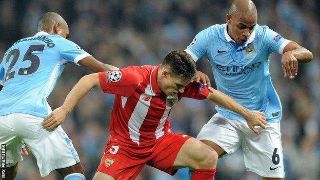 Manchester City duo Fernando and Fernandinho in action together against Sevilla