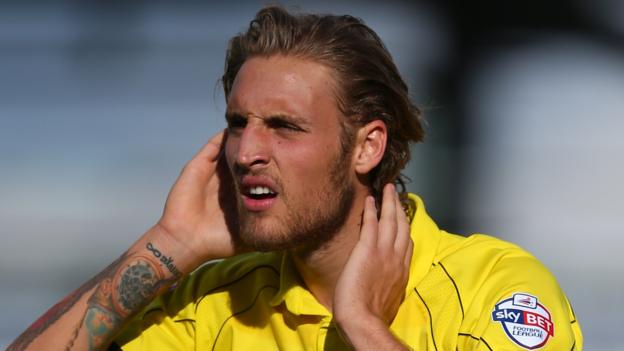 Mansfield sign defender Taft from Burton