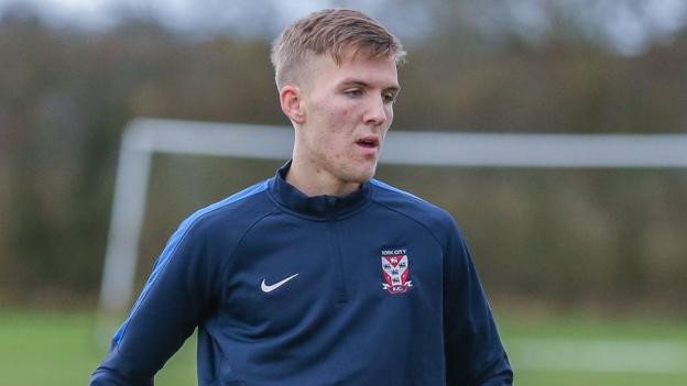 Mark Kitching: Middlesbrough defender joins Rochdale on loan