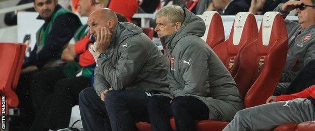 Arsene Wenger (centre right) with coach Steve Bould