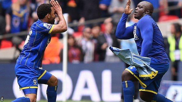 Adebayo Akinfenwa (right)