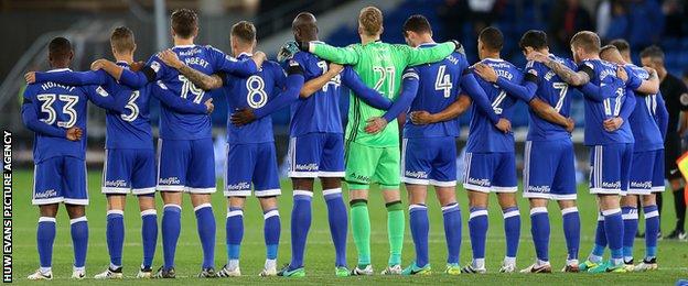 Cardiff City players observe a minute’s silence to mark the 50th anniversary of Aberfan disaster