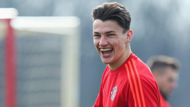 Regan Poole: Manchester United defender loaned to Northampton Town