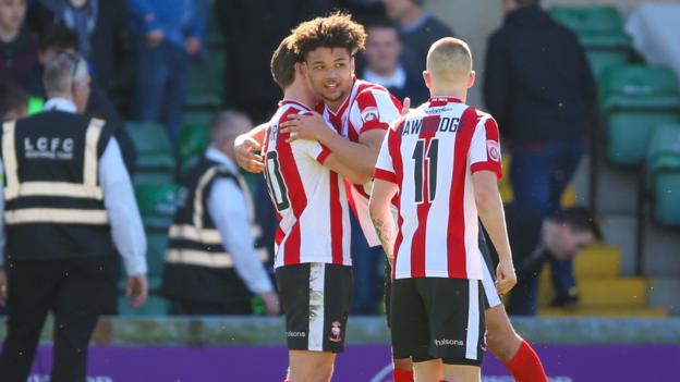 Lincoln City come from behind to go top of National League