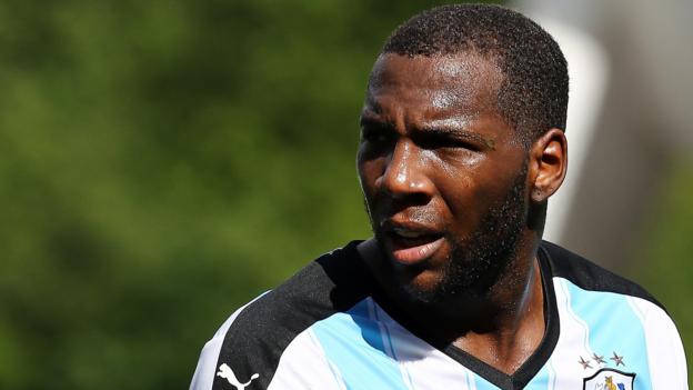 Ishmael Miller: Bury sign former Huddersfield Town forward