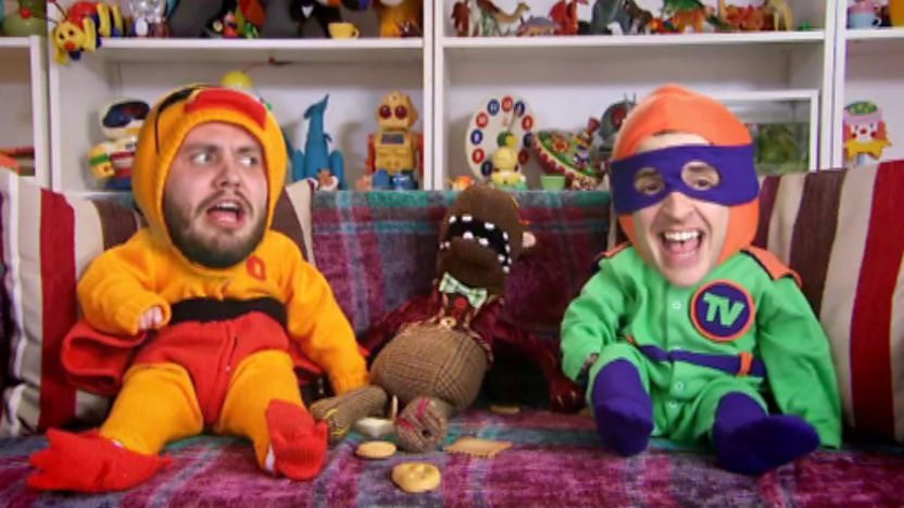 Brooks and Rocco in superhero outfits.