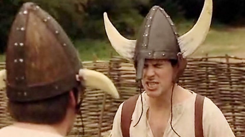 Dick and Dom wearing Viking helmets.