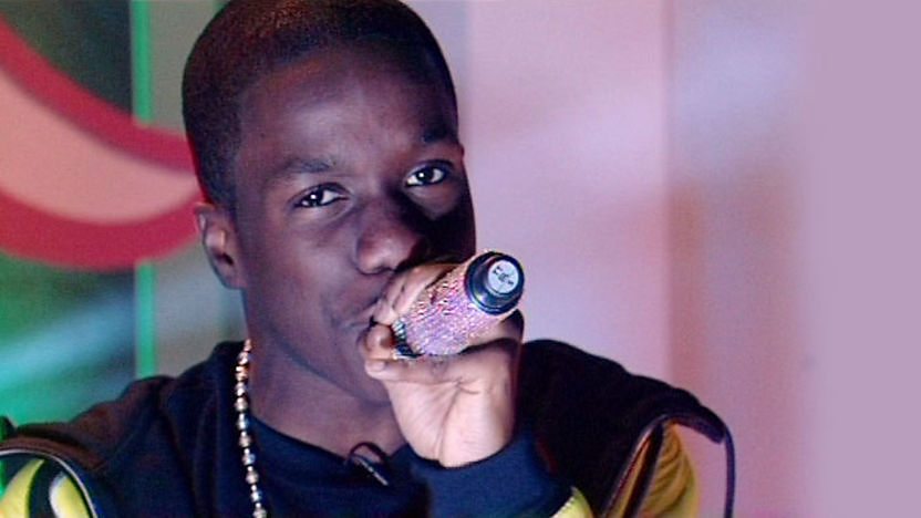 Tinchy Stryder rapping on stage