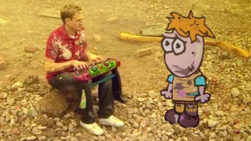 Big Howard sits with a children's keyboard with Little Howard.