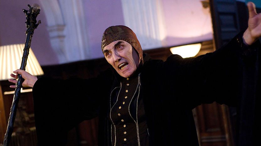 Erasmus Darkening holding his arms out.