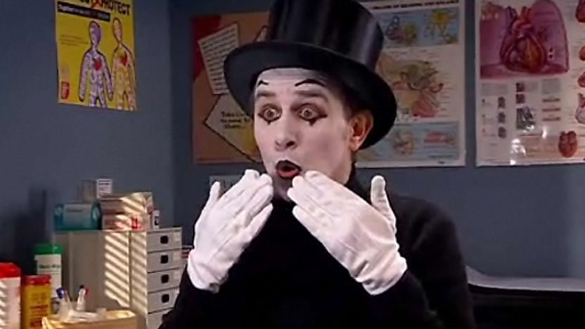 Man dressed up as a mime artist. 