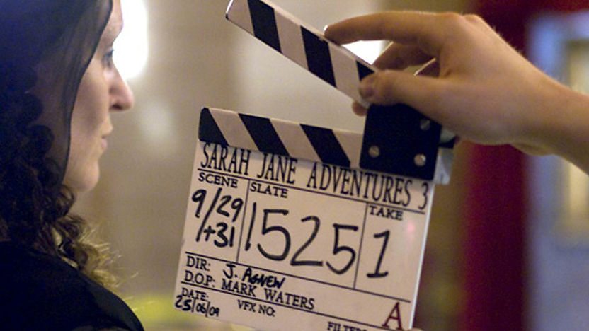 Mona Lisa and a clapper board.