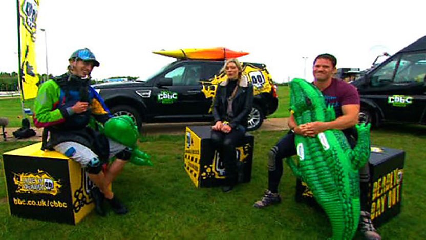 Steve Backshall and James Bebbington holding inflatable crocs and sitting with Naomi Wilkinson