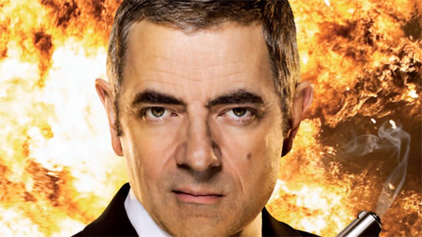 Johnny English surrounded by flames