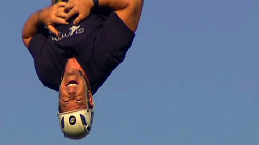 Steve Backshall hanging upside down 30 metres in the air