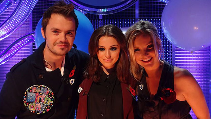 Cher Lloyd in the Blue Peter studio with presenters Barney and Helen.