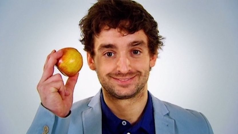 Fergus holding an apple.