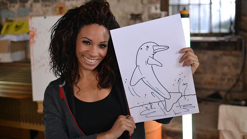 Image of Michelle with a drawing of a dolphin.