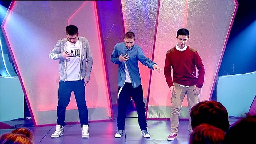 Richard, Aidan and Cel on stage dancing.