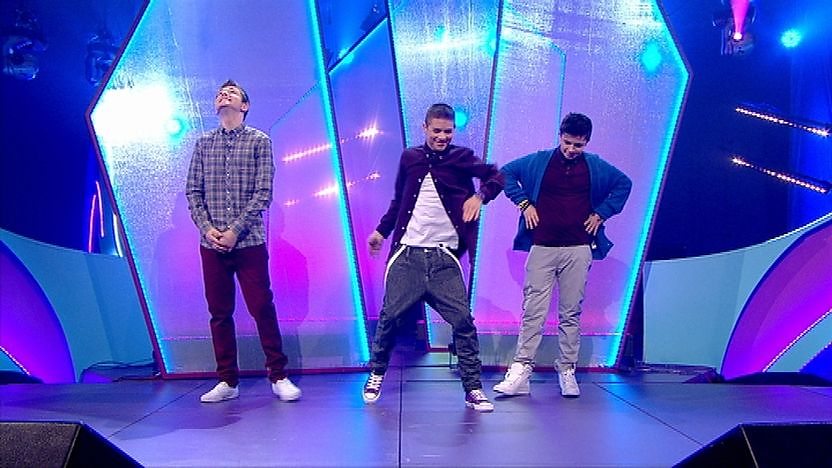 Richard, Aidan and Cel on stage dancing.