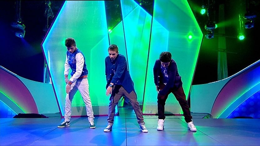 Aidan Davis, Richard Wisker and Ceallach Spellman on stage dancing.