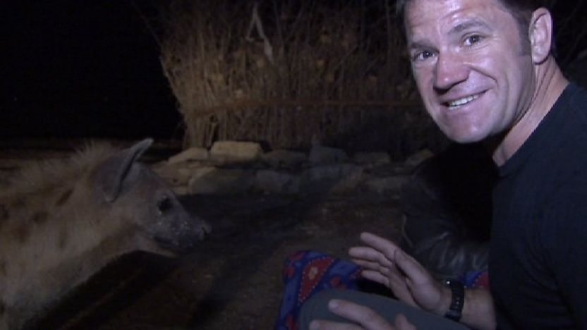 Steve Backshall with a hyena