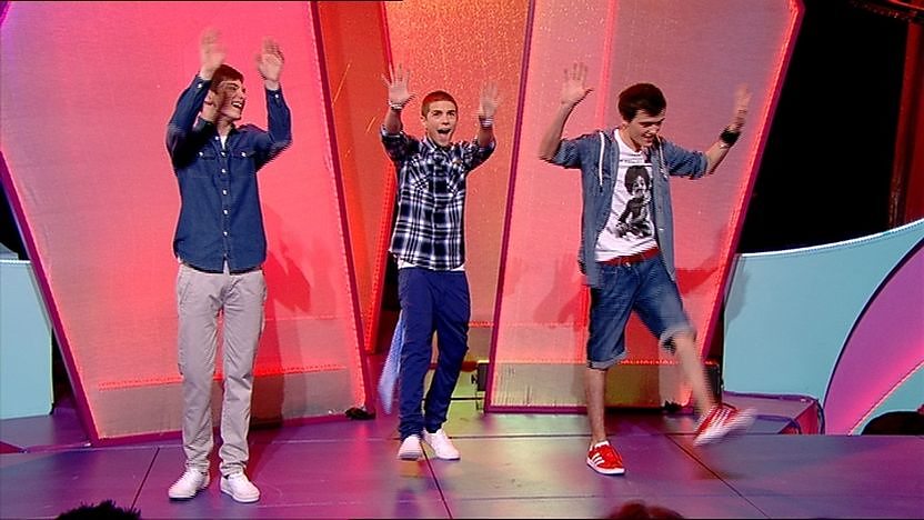 Aidan Davis, Richard Wisker and George Sampson on stage dancing.