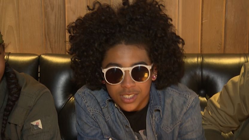 Princeton from Mindless Behavior looking into the camera while wearing sunglasses indoors.