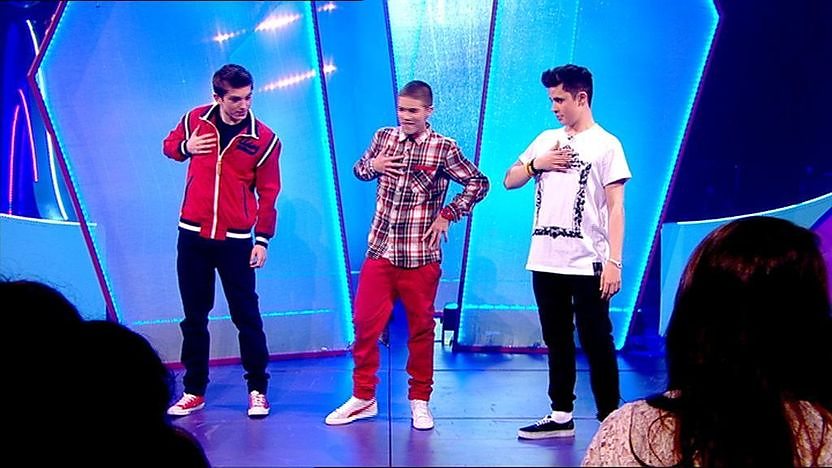 Aidan Davis, Richard Wisker and Ceallach Spellman dancing on stage. 